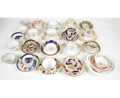 A collection of 19th century predominantly New Hall porcelain tea cups, saucers, tea bowls and a serving dish. CONDITION REPO
