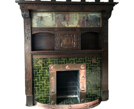 A good oak Arts and Crafts fireplace, the moulded mantel above original oil painted panel with clock dial below and with carv
