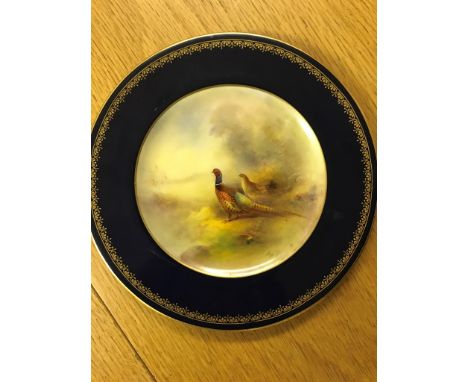 A Royal Worcester cabinet plate, painted by Stinton, depicting pheasants on a blue ground: W 15.5 cm