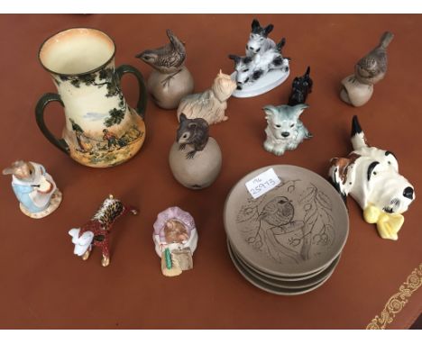 A quantity of ceramics to inc Poole animals, Beswick dogs etc