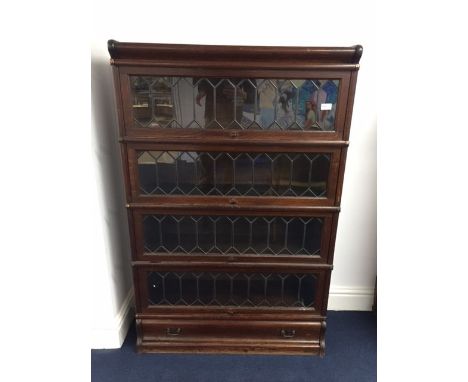 An oak four-tier Globe Wernicke bookcase with leaded glass