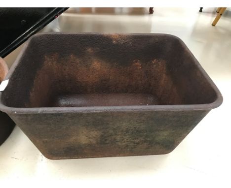 A cast-iron feeding trough