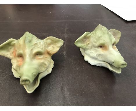 A pair of Continental ceramic ash trays in the form of a boar's head