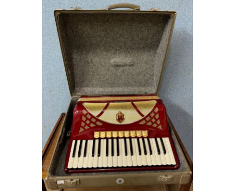 A cased Hohner accordion 