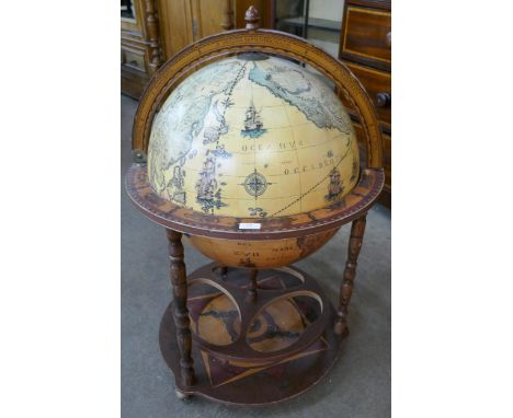 An Italian style terrestrial globe cocktail cabinet/trolley 