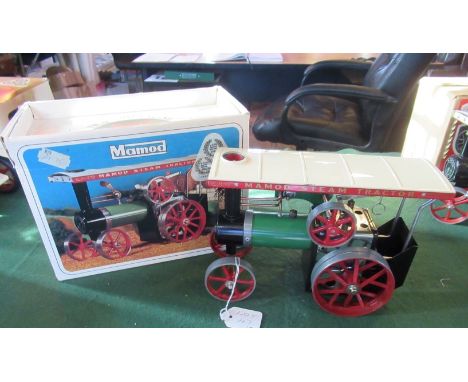 A boxed Mamod steam tractor.