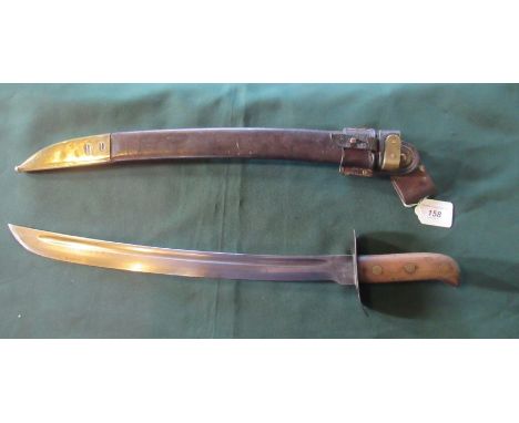 A Klewang 'Heiho' cutlass in brass mounted leather scabbard.