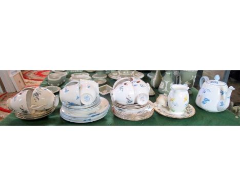 A Colclough part-tea service, decorated with bluebirds, together with another, decorated with cut floral sprigs.