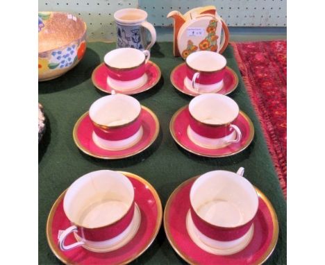 A 1930's Clarice Cliff Bizarre Sunshine pattern teapot, a 1953 coronation mug, the base with painted mark Seviers and a set o