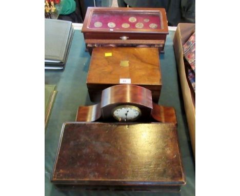 A three drawer coin collector's cabinet, containing a small quantity of commemorative crowns and other coins, a carved hardwo