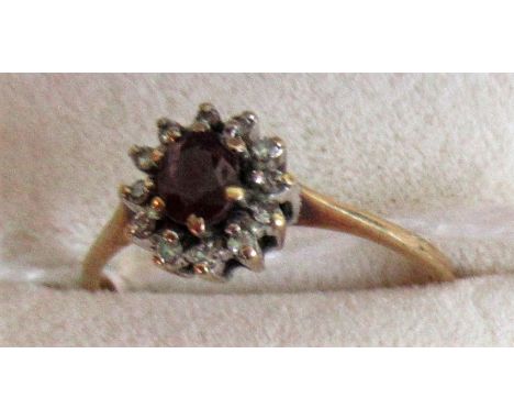 A diamond and ruby set 9ct gold ring.