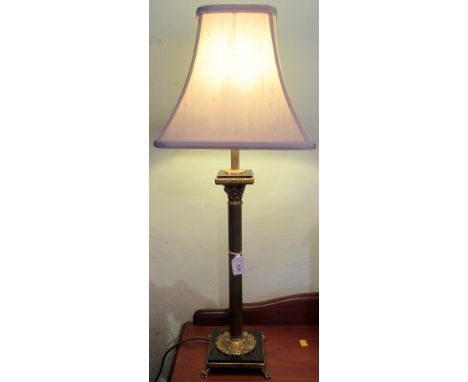 A brass Corinthian column table lamp with silk shade.