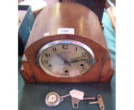 A Bravingtons oak cased mantle clock, the eight day movement playing Westminster and Whittington chimes on gongs, together wi