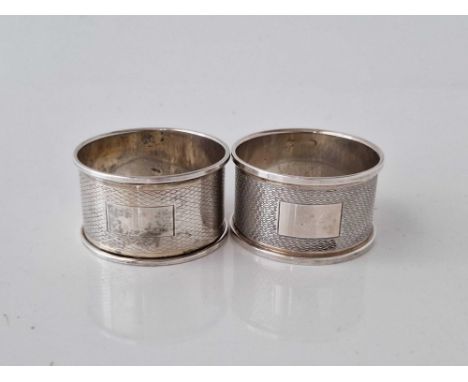 A pair of engine turned napkin rings, Birmingham 1964