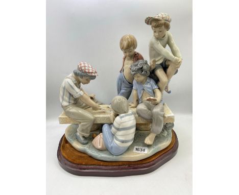 A Dao large group of five children playing cards 12 inches high