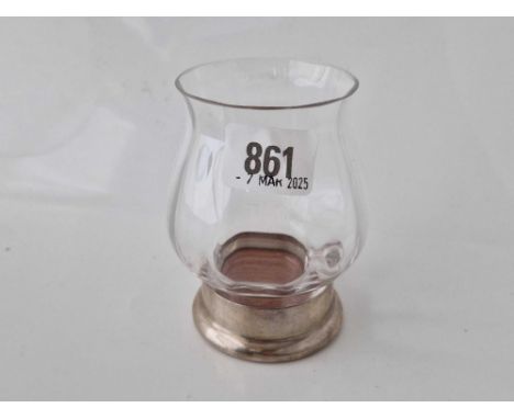 A Dartington Crystal Candleholder on a silver mounted coaster