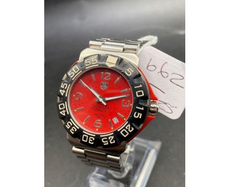 A GENTS TAG HEUER FORMULA ONE WITH WRIST WATCHES SECONDS SWEEP AND DATE APERTURE ON ORIGINAL STRAP