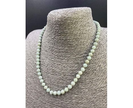 A row of uniform translucent green jade necklace with gold clasp 17 inch