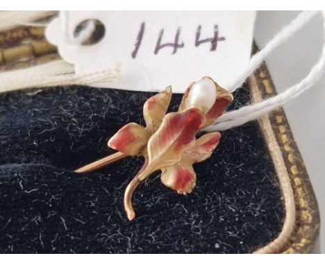 A gold enamelled stick pin designed as a fuchsia set with a pearl in a lawley And Sons Plymouth box