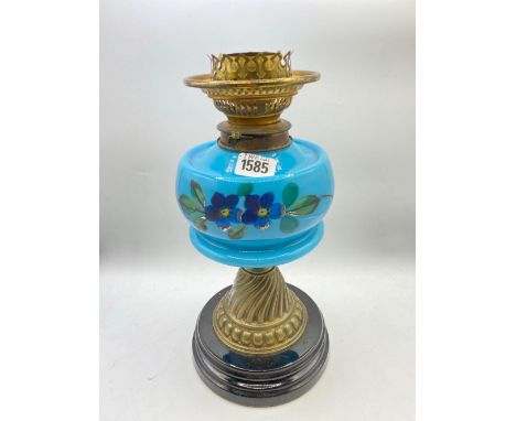 A Victorian glass and brass mounted oil lamp
