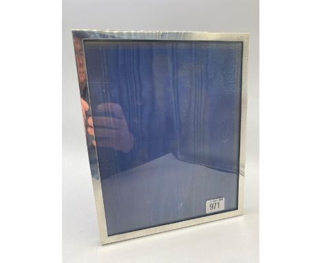 A plain oblong photo frame easel back, 11 inches high, London 1966, 135g weighable silver