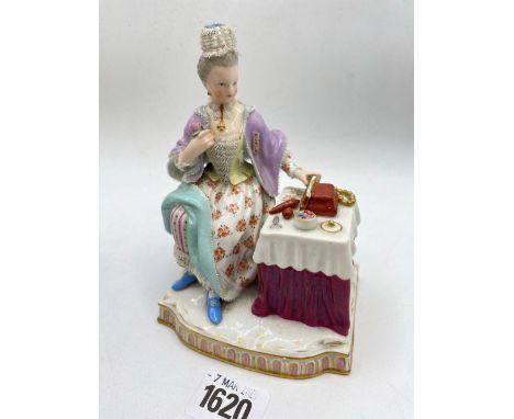 A Dresden figure of a lady seated at a dressing table 6 inches high