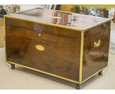 TRUNK, 19th century Anglo Indian, teak and brass bound, with hinged top and side handles, 102cm W x 61cm D. 