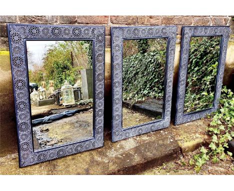 ARCHITECTURAL GARDEN MIRRORS, three, 91cm x 63cm, Spanish style black painted metal frames. (3) 