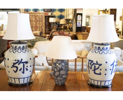 TABLE LAMPS, a pair, 77cm H including shades, Chinese blue and white ceramic, and another smaller lamp, 53cm H overall. (3) 