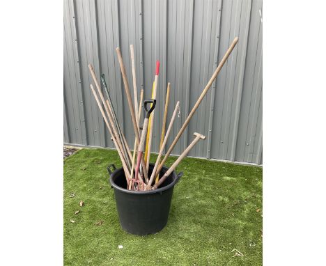 Plastic tub with gardening tools