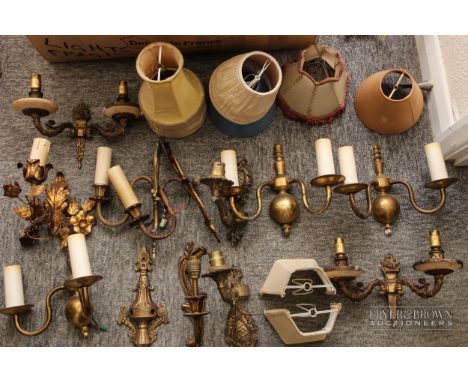 A quantity of antique and vintage brass wall light fittings and shades (qty)