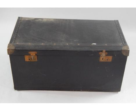 A vintage car trunk, with hinged lid and fall front in black American cloth, with leather carrying handles.