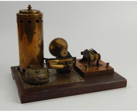 A vintage scratch built standing steam engine, mounted on a mahogany plinth, the base plate with Wor-Mar Trademan Stamp.