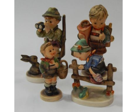 Four Goebel Hummel figures.