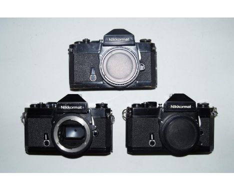 Two Nikon Nikkormat FT3 camera bodies, and a Nikon Nikkormat FT2 camera body,  (3).