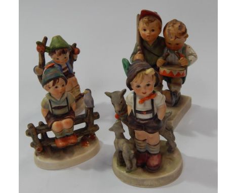 Four Goebel Hummel figures.