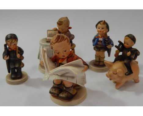 Five Goebel Hummel figures.