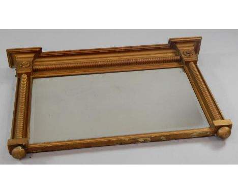 A Victorian gilt framed overmantel mirror, with moulded cornice and with a rectangular bevelled glass within bobbin moulded f