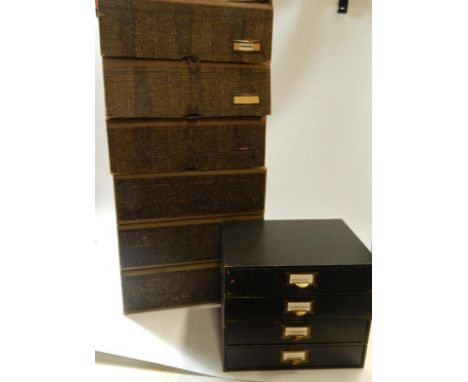 A stack of East-Light cabinet box files, with mock lizard skin covering, and a small nest of drawers.