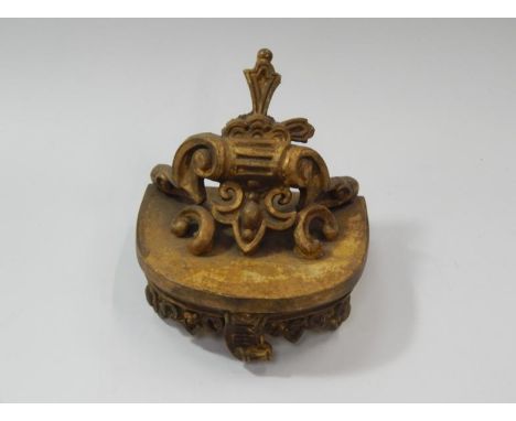 A gilt wood shelf bracket.