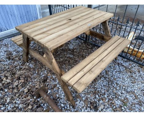 A WOODEN PICNIC BENCH AND TABLE 