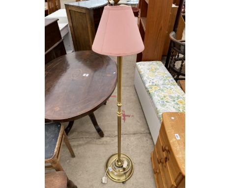 A SMALL BRASS STANDARD LAMP COMPLETE WITH SHADE 