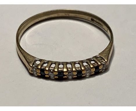 A 9 CARAT GOLD RING WITH IN LINE SAPPHIRES AND CUBIC ZIRCONIAS SIZE P/Q 