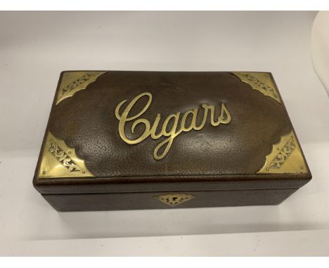 A VINTAGE LEATHER AND BRASS CIGAR BOX 
