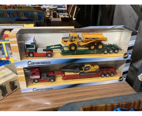 TWO CARARAMA TRUCKS ONE WITH A VOLVO DIGGER AND ONE WITH A VOLVO DUMPER TRUNK 