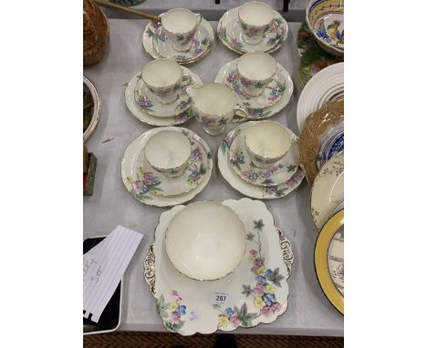 A VINTAGE OLD FOLEY TEASET DECORATED WITH A FLORAL PATTERN TO INCLUDE CUPS, SAUCERS, SIDE PLATES, A CAKE PLATE, SUGAR BOWL AN