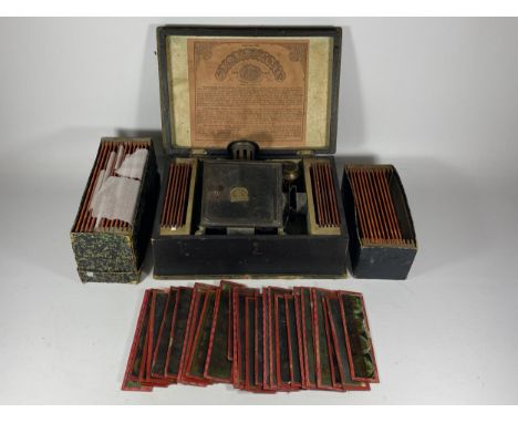 A BING GERMAN BOXED SLIDE LANTERN WITH ASSORTED SLIDES 