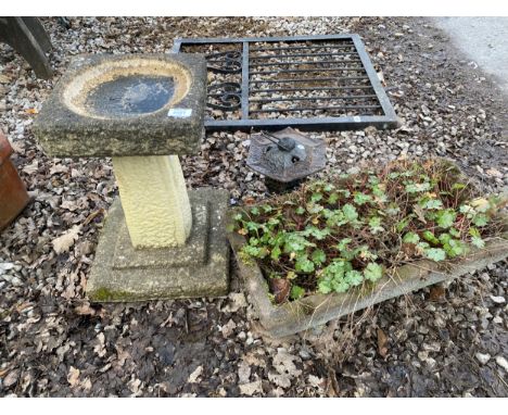 A RECONSTITUTED STONE BIRD BATH AND PLANTER AND A CAST METAL CANDLE LANTERN 