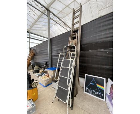AN ABRU EXTENDABLE LADDER, A SIX RUNG ALUMINIUM STEP LADDER AND TWO FURTHER STEP LADDERS 