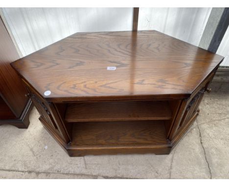 A NATHAN FURNITURE CORNER TV STAND WITH DOUBLE SIDED LINENFOLD DOORS, 39" WIDE 